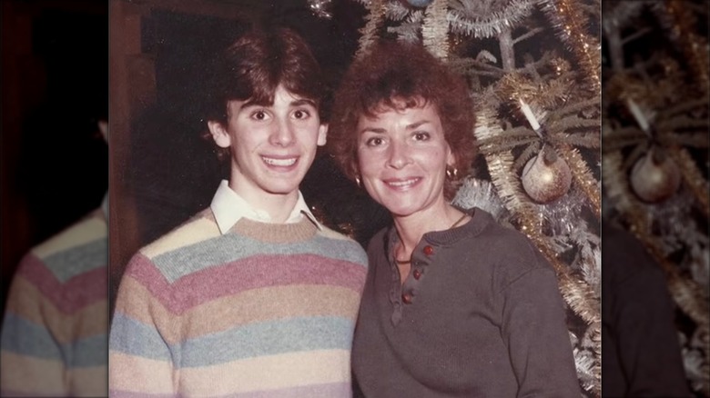 A young Adam Levy smiling with his mom Judge Judy.