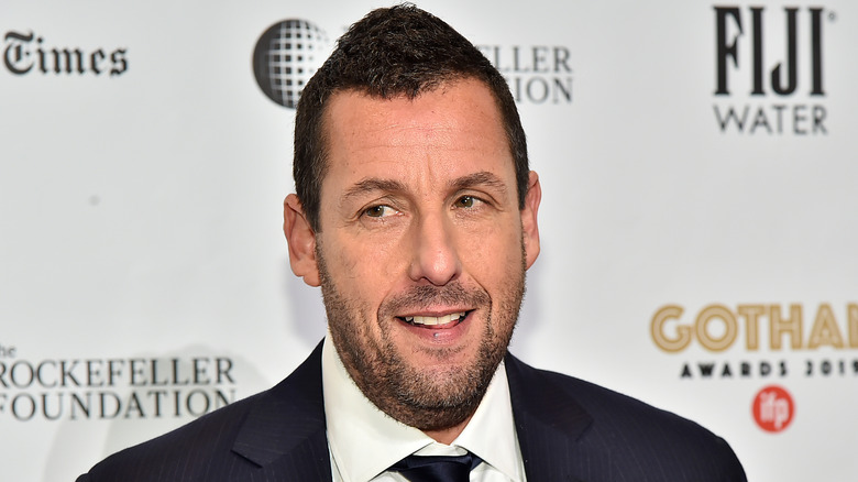 Adam Sandler posing for cameras