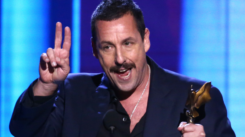 Adam Sandler giving an acceptance speech