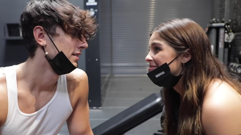 Bryce Hall and Addison Rae looking at each other