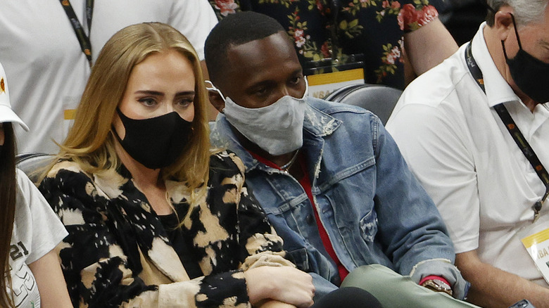 Adele and Rich Paul in masks at basketball game