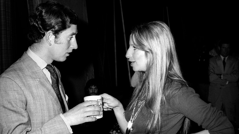 King Charles III and singer Barbra Streisand share a moment over coffee in 1974.