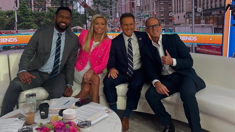 Ainsley Earhardt wearing a bright pink blazer on Fox & Friends