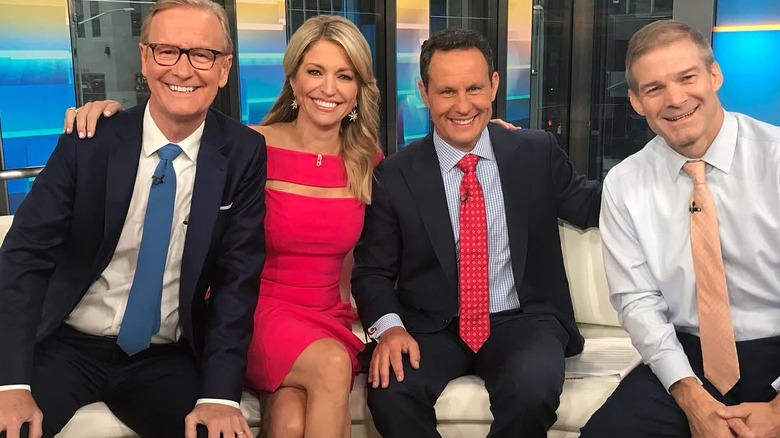 Ainsley Earhardt wearing a pink dress with a cut-out on Fox & Friends