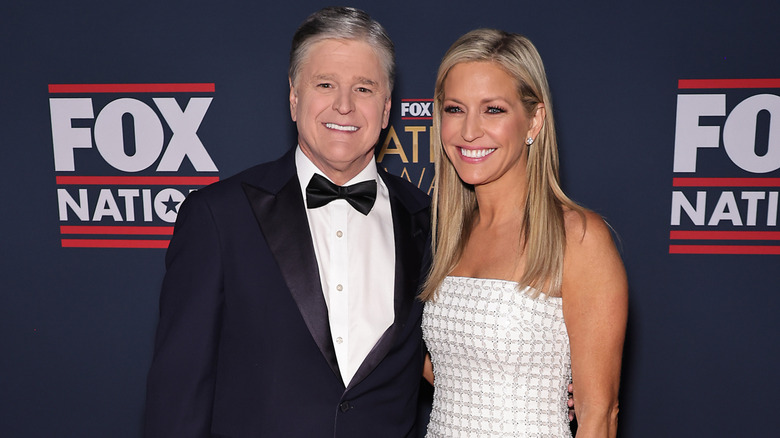 Sean Hannity and Ainsley Earhardt posing for photos at the FOX Nation's 2024 Patriot Awards at Tilles Center for the Performing Arts