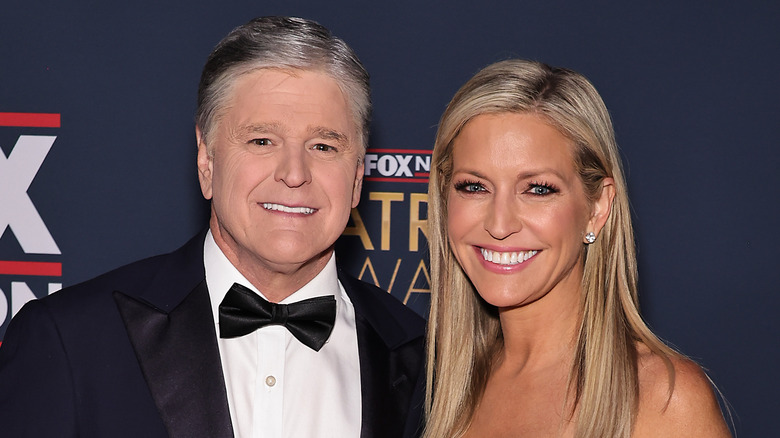 Sean Hannity and Ainsley Earhardt posing together at a Fox News red carpet event