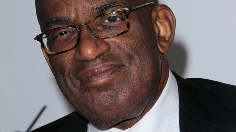 Al Roker poses in a suit