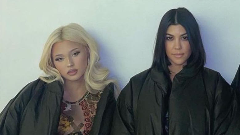Alabama Barker posing with Kourtney Kardashian
