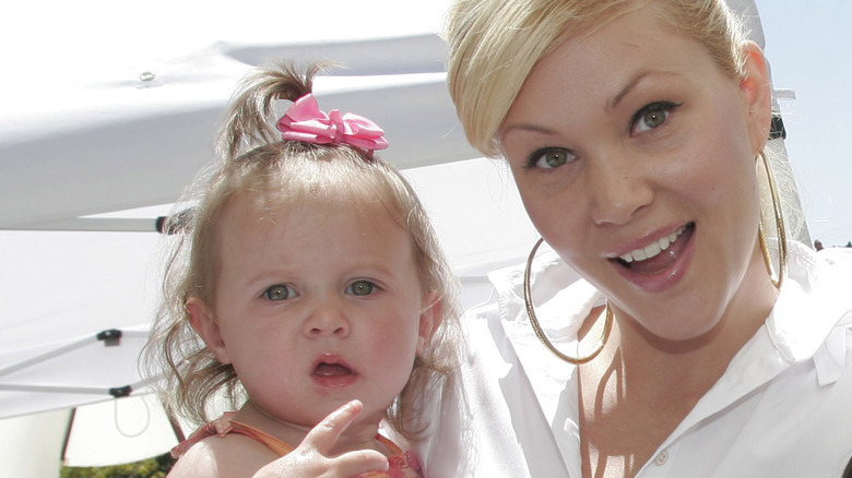 Alabama Barker posing with mother Shanna Moakler