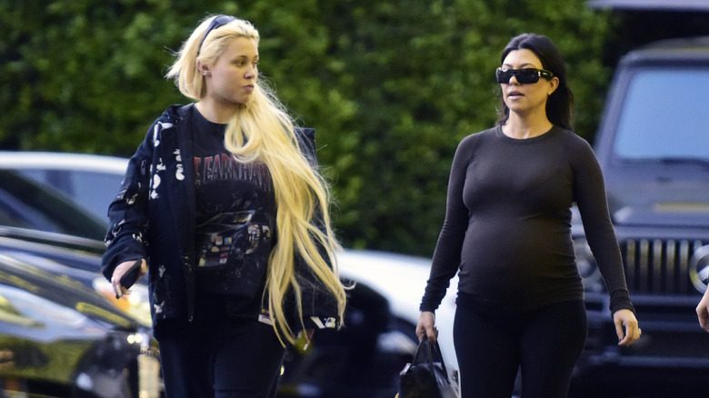 Alabama Barker walking with Kourtney Kardashian