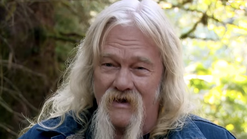 Billy Brown, sitting outside, talking, long white hair, long beard