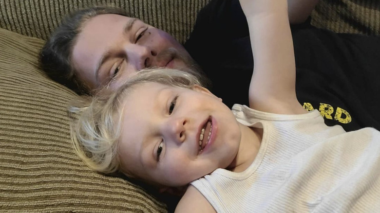 Noah Brown napping with son
