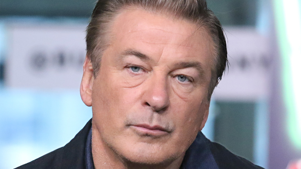 Alec Baldwin looks serious during an interview