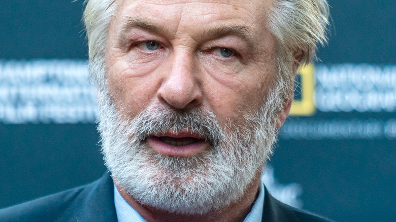 Alec Baldwin short gray beard looking left