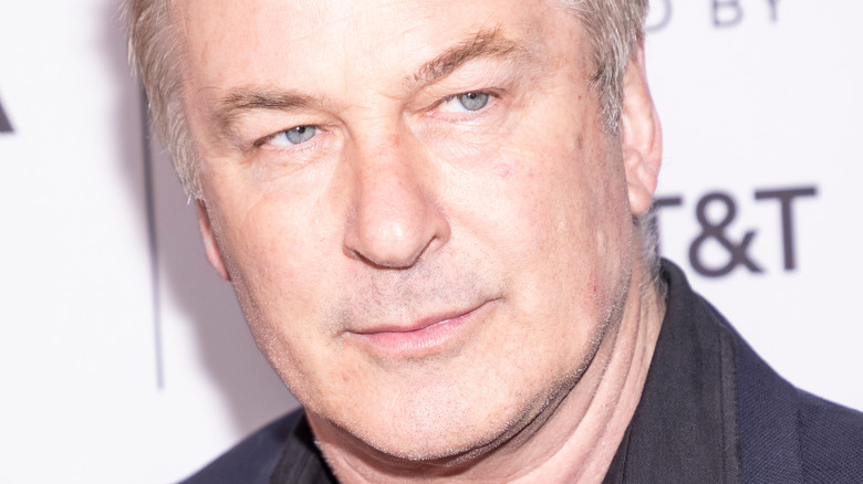 Alec Baldwin side eye left looking stern