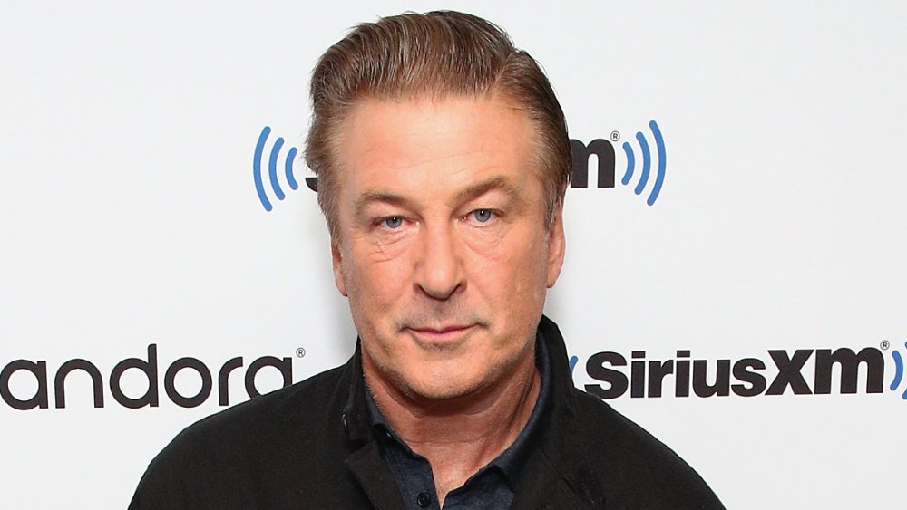  Alec Baldwin with a slight smile 