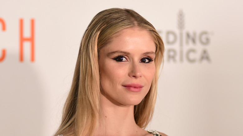 Close up of Erin Moriarty posing in front of beige background