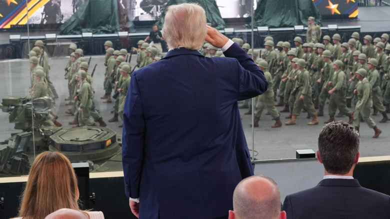 Donald Trump saluting at his birthday military parade