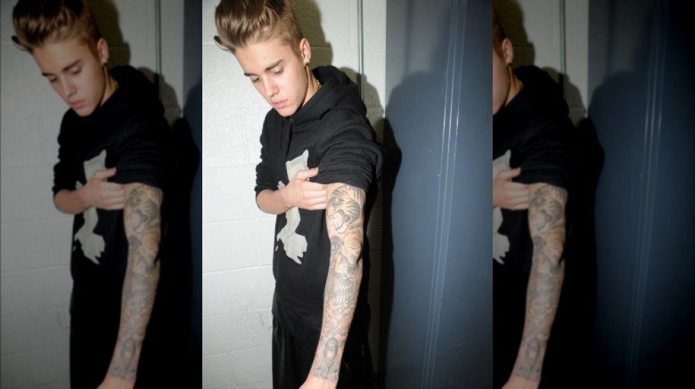 24 of Justin Biebers tattoos explained in slightly creepy detail