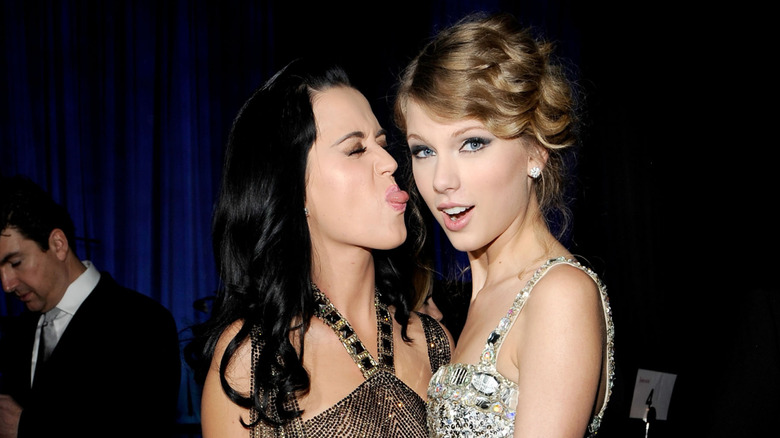 Katy Perry sticking her tongue out at Taylor Swift while posing together