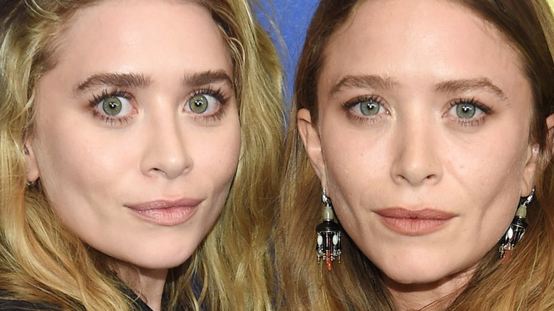 Mary-Kate and Ashley Olsen posing 