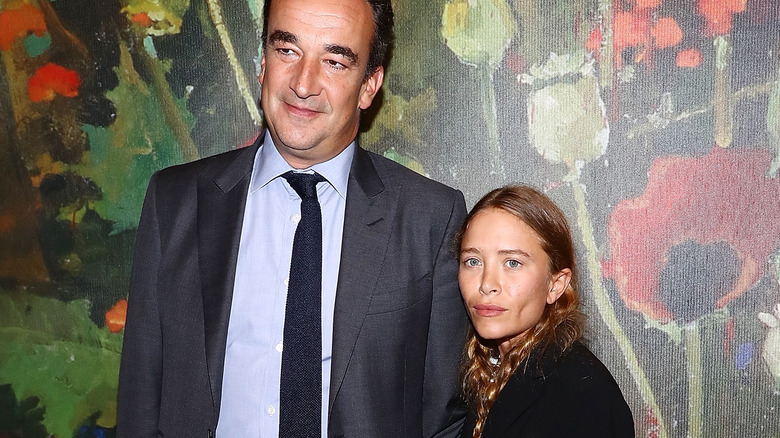 Mary-Kate Olsen and Olivier Sarkozy posing 