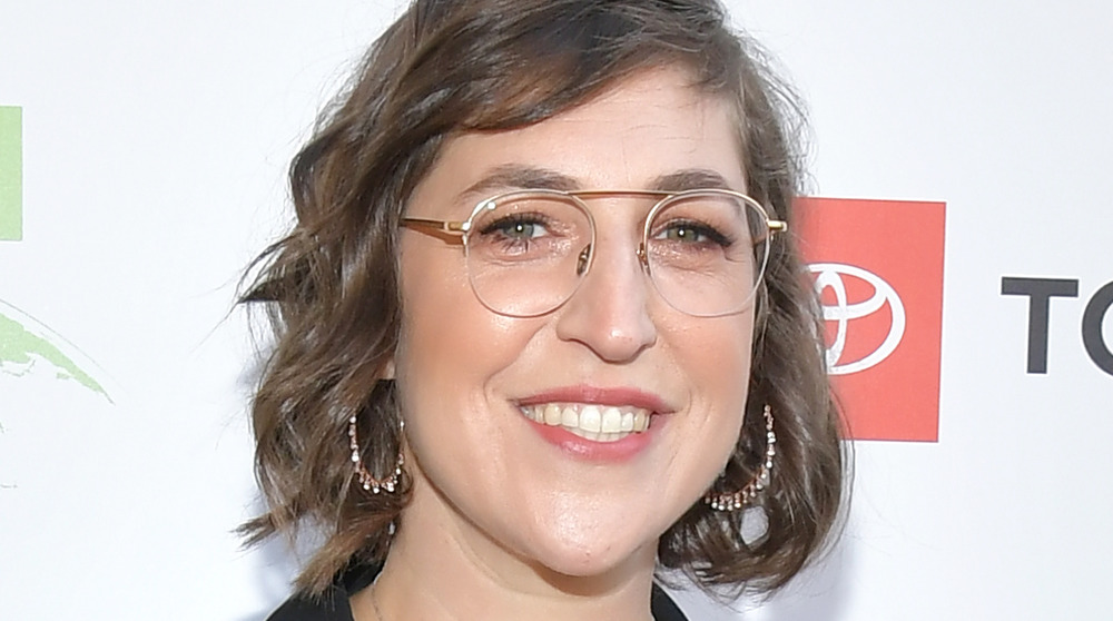 Mayim Bialik smiling with glasses on
