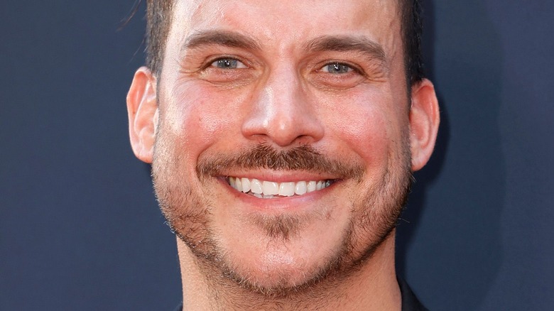 Jax Taylor grinning slicked back hair