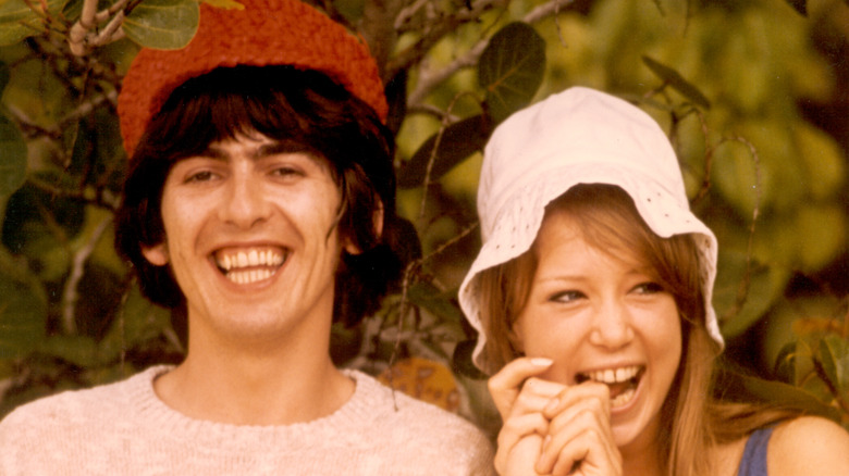 George Harrison and Pattie Boyd posing for cameras in 1966