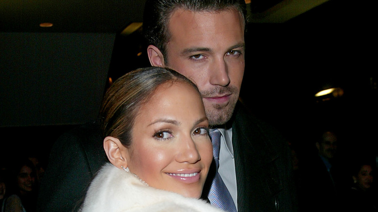 Jennifer Lopez smiling while posing with Ben Affleck