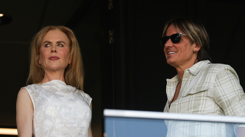 Nicole Kidman looking away; Keith Urban smiling