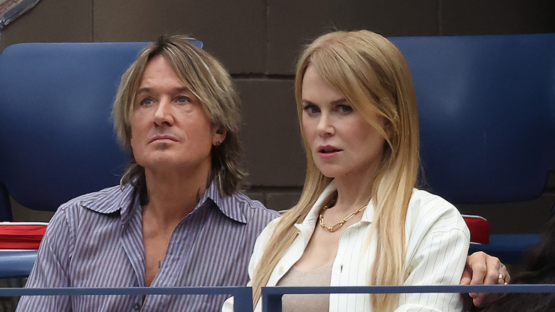 Keith Urban with his arm around Nicole Kidman's shoulders