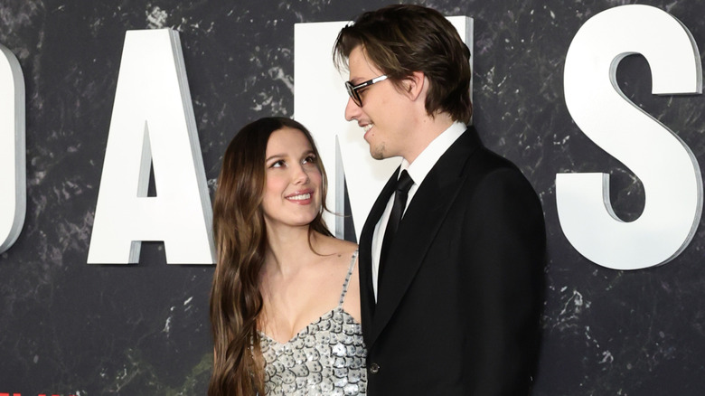 Millie Bobby Brown and Jake Bongiovi smiling at each other