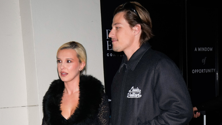 Millie Bobby Brown and Jake Bongiovi looking away