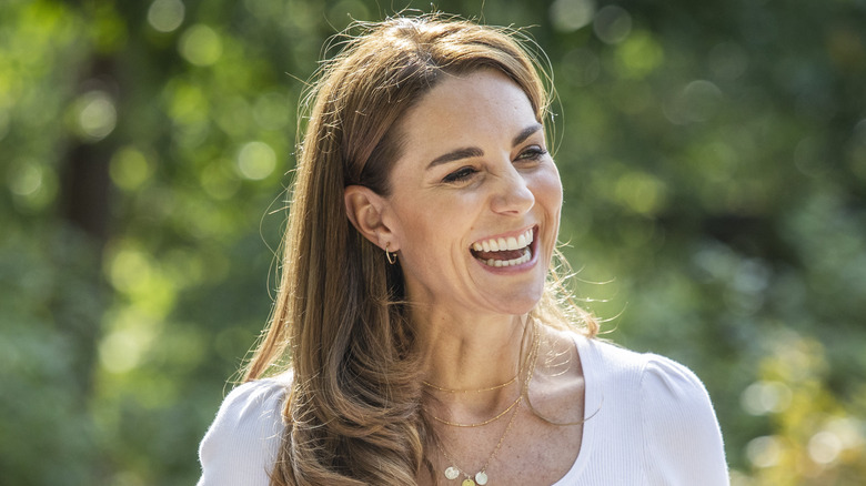 Kate Middleton white top laughing
