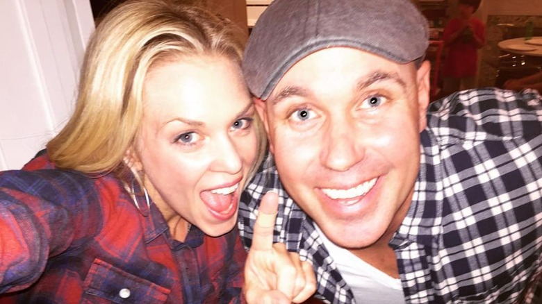 Dave Wilson smiling as open-mouthed Kortney Wilson takes a selfie