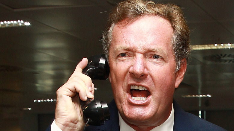 Piers Morgan yelling into a phone