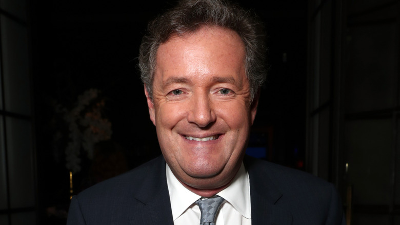 Piers Morgan posing for photo