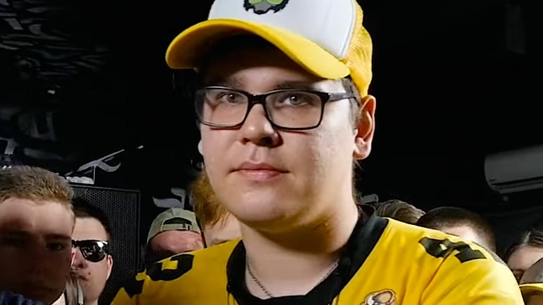 Walkie wearing glasses and a baseball hat