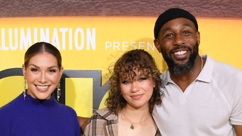 Allison Holker and Stephen "tWitch" Boss smiling with daughter Weslie.