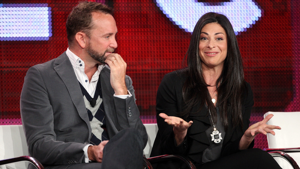 Stacy London and Clinton Kelly sit next to each other