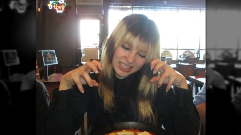 Alysa Liu poses for a photo at a restaurant