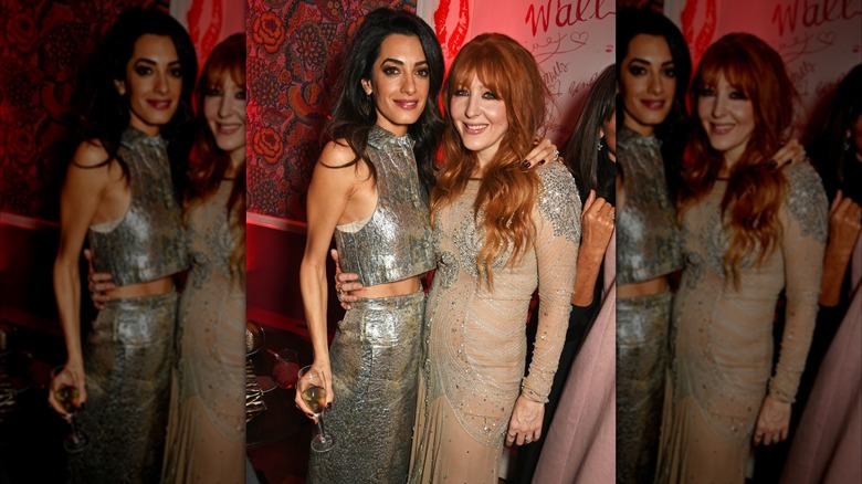 Amal posing with Charlotte Tilbury at a Christmas party