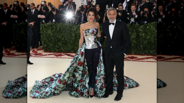 Amal and George posing at the Met Gala together
