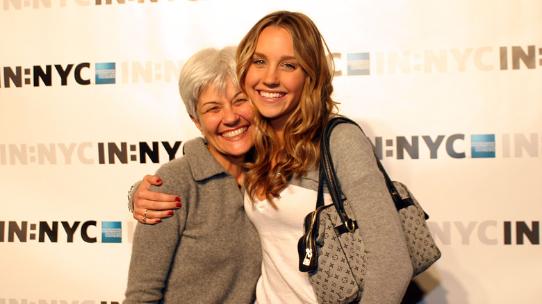 Amanda and Lynn Bynes emrbacing