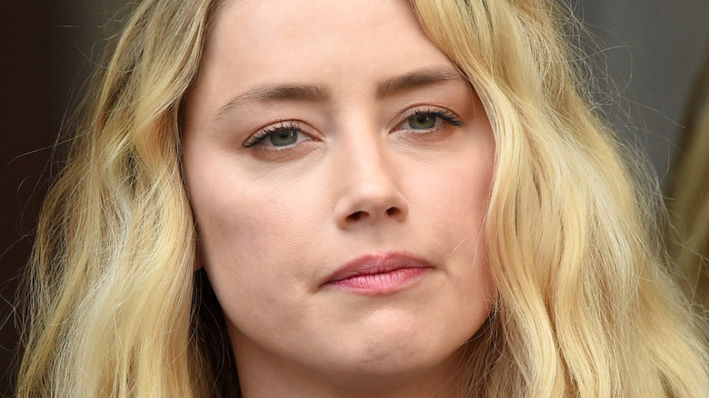 Amber heard closed mouth frown