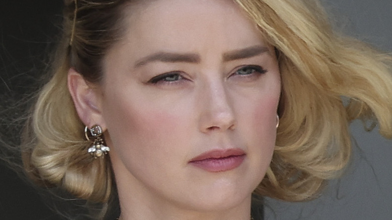 Amber Heard short curly blonde bob bee earrings