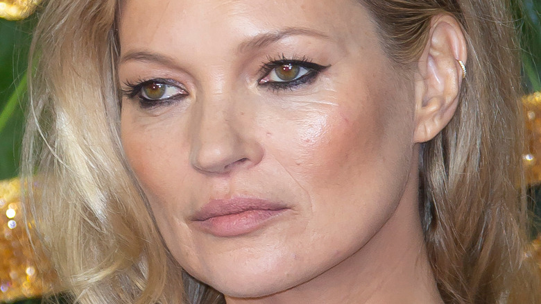 Kate Moss poses with wavy hair down