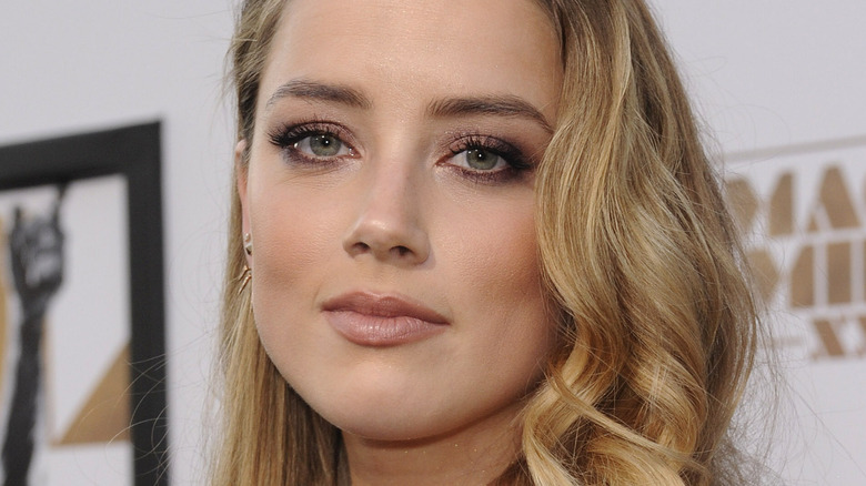 Amber heard side swept hair looking into camera
