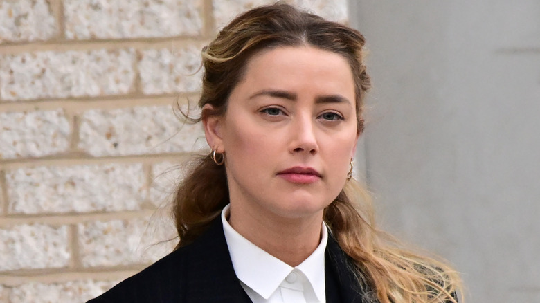mber Heard departs outside court during the Johnny Depp and Amber Heard civil trial at Fairfax County Circuit Court